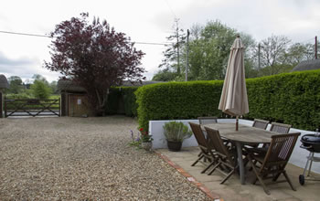 Enford House self catering cottage has a lovely south facing terrace with a barbeque