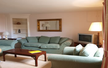 Enford House self catering holiday cottage has a spacious sitting room with 2 3 seater sofas, armchair, tv, dvd, wifi